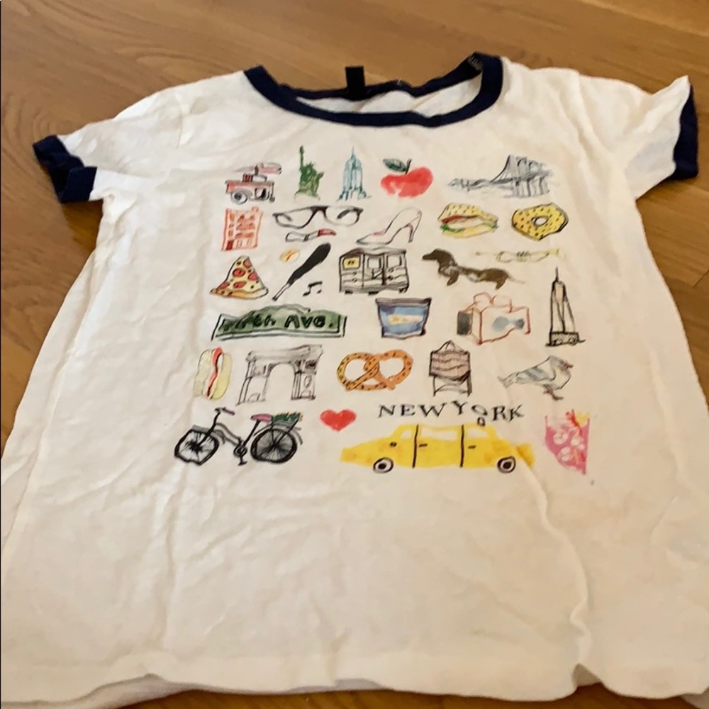 A J. Crew shirt with prints on the front.